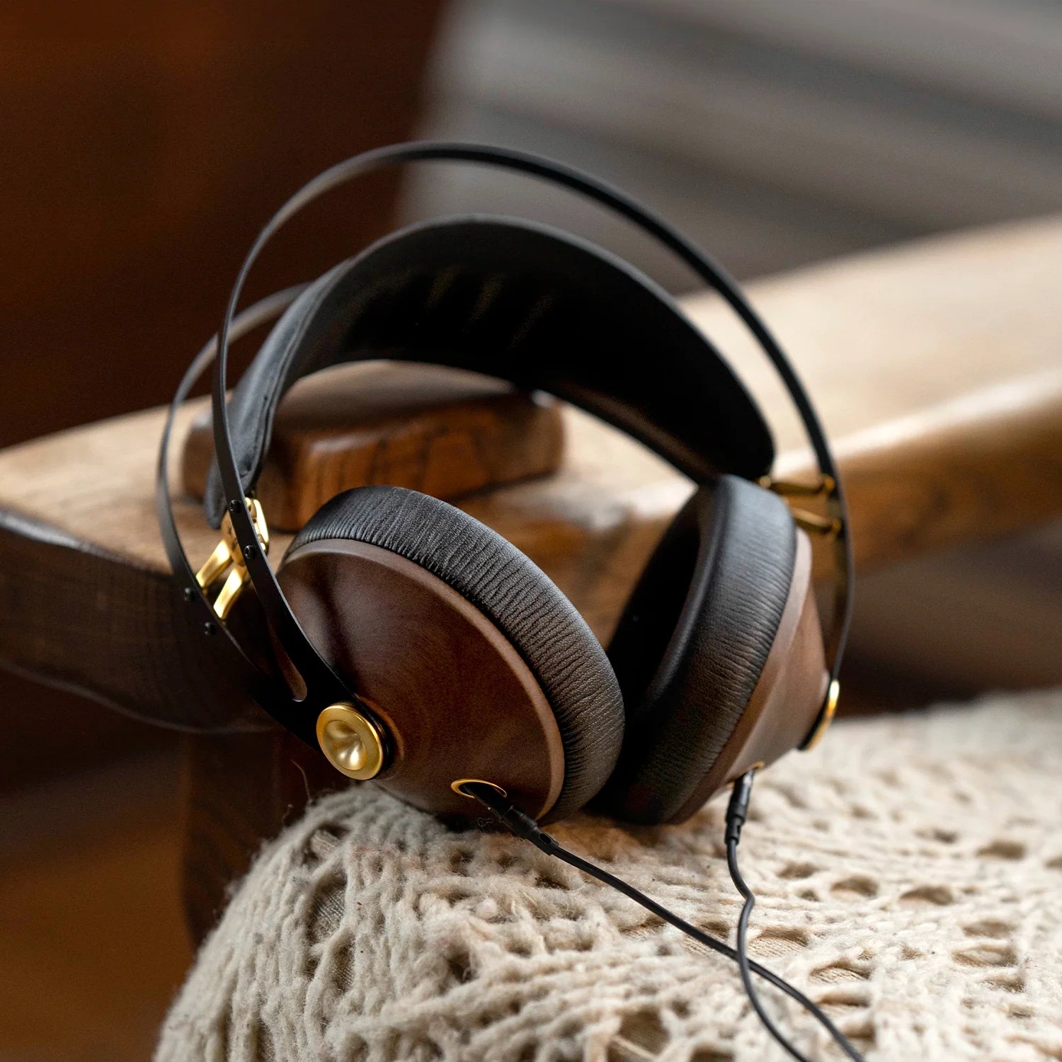 Premium closed-back audiophile headphones with walnut wood ear cups, highlighting high-fidelity sound and luxurious design for music enthusiasts.