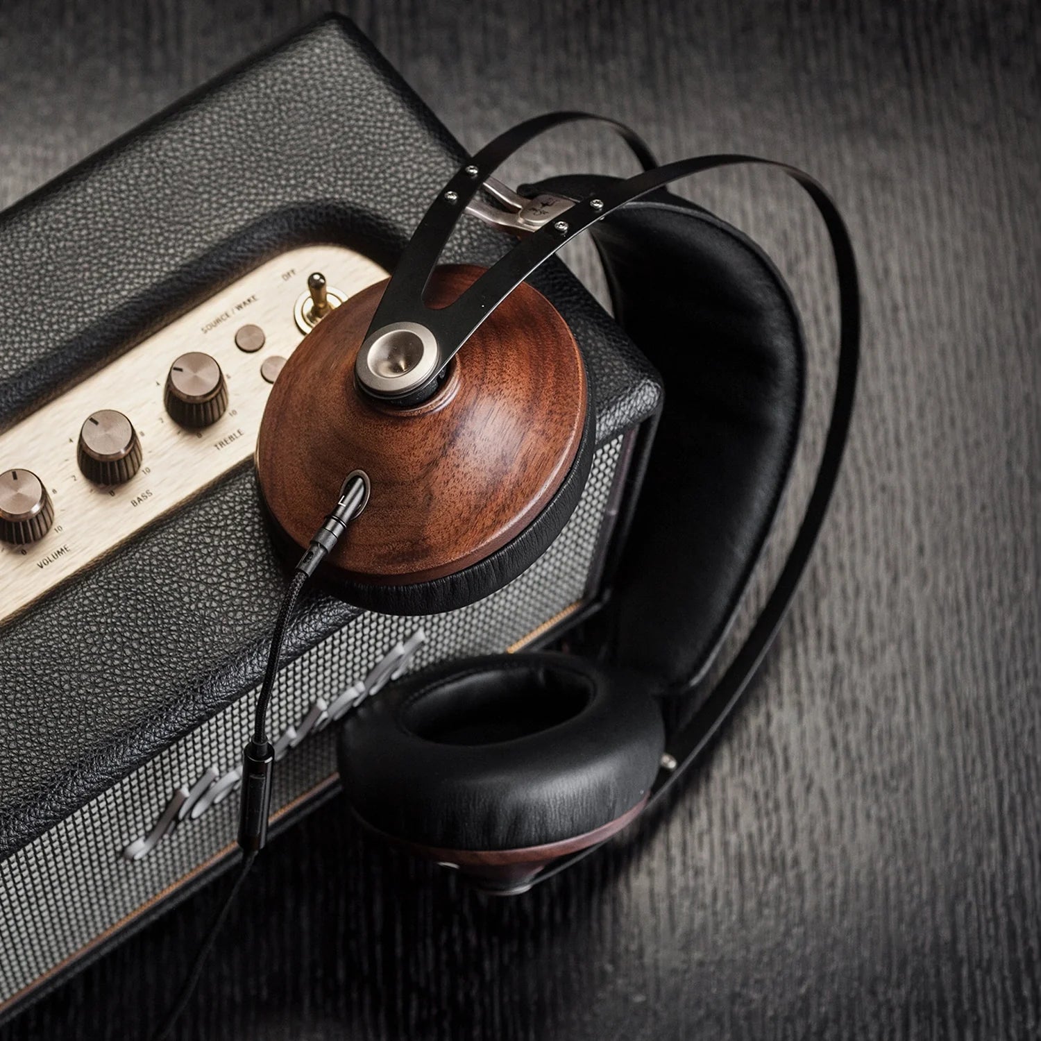 Meze Audio 99m Classics Walnut SIlver best premium audiophile closed-back headphones mounted on a guitar amp head